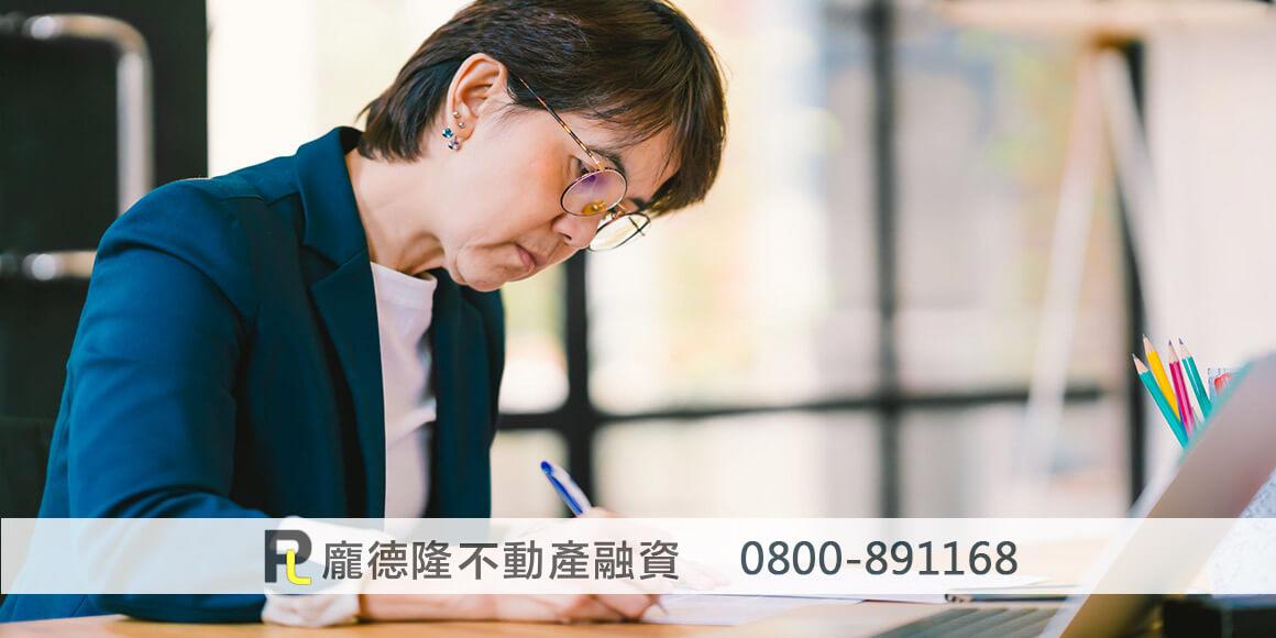 Woman signing documents